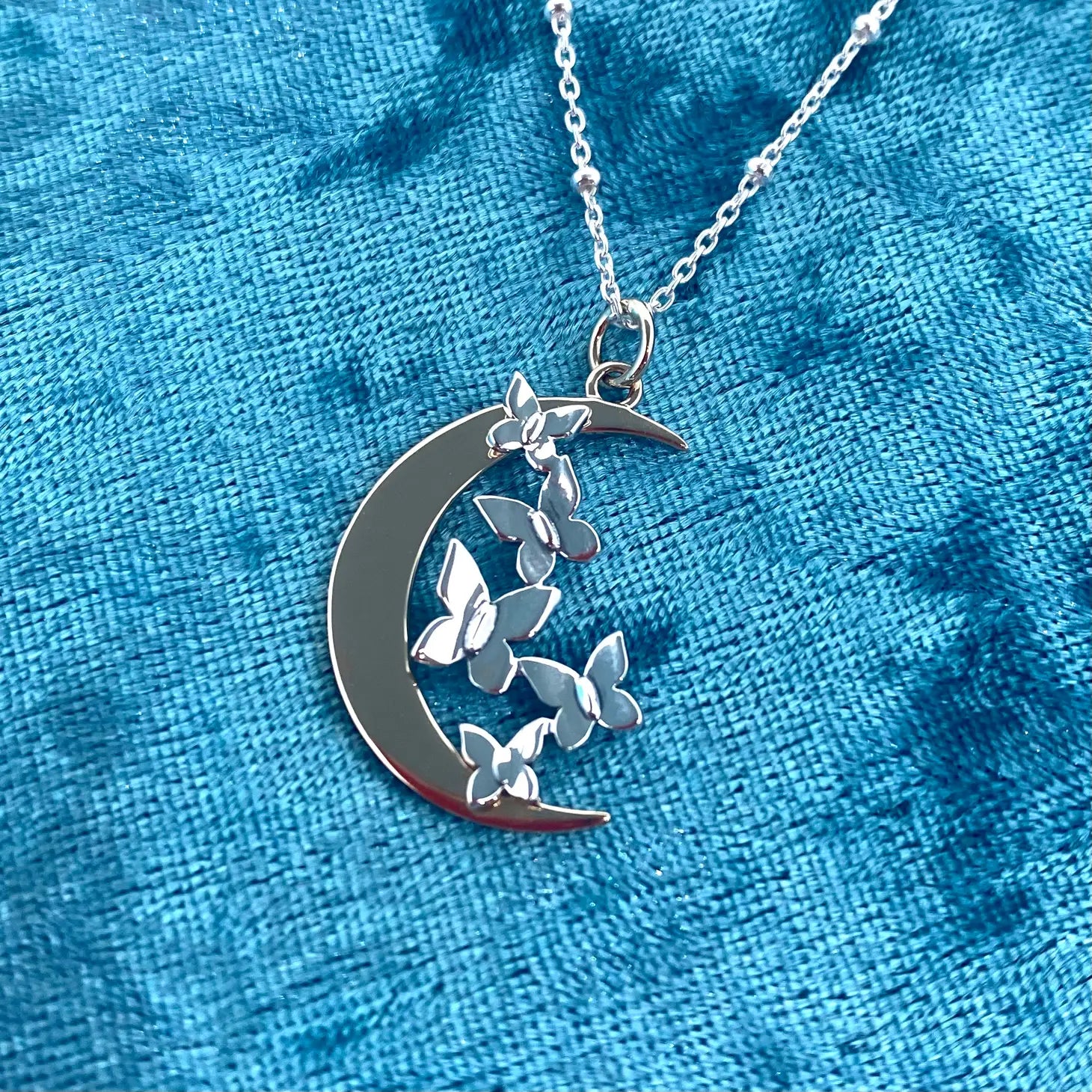 Sterling silver butterflies on bronze moon necklace